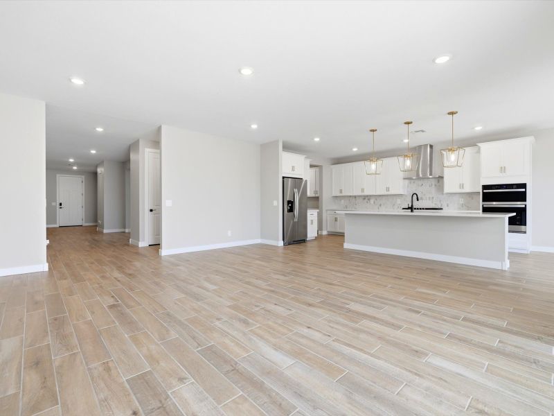 Spacious, unfurnished interior of a new home in White Tank Foothills Signature Series, Waddell (Image 11).