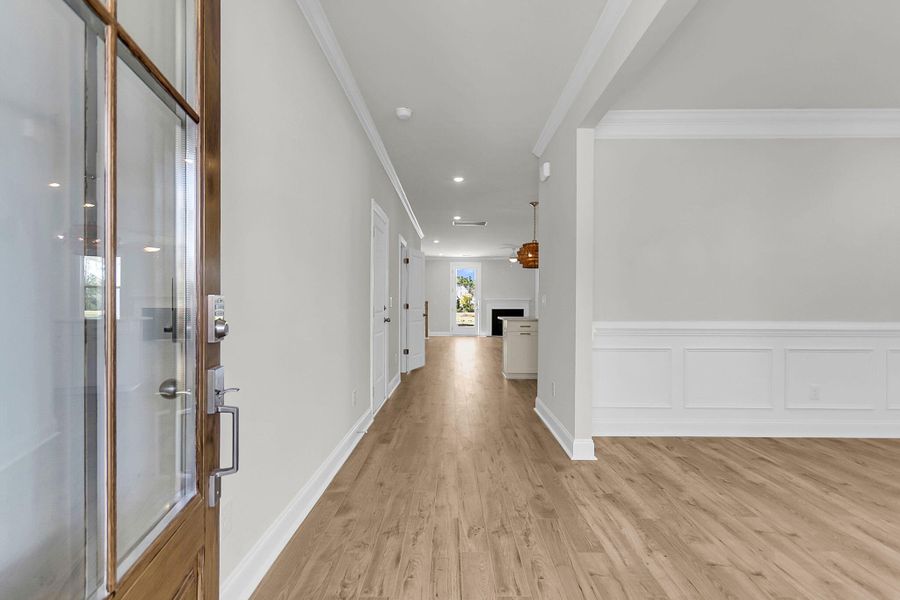 Spacious, unfurnished interior of a new home in Tidewater at Lakes of Cane Bay, Summerville (Image 13).