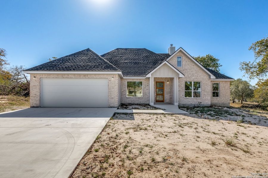 Front exterior of a new home in , Poteet, TX, highlighting curb appeal (Image 1). Front exterior of a new home in , Poteet, TX, highlighting curb appeal (Image 1).