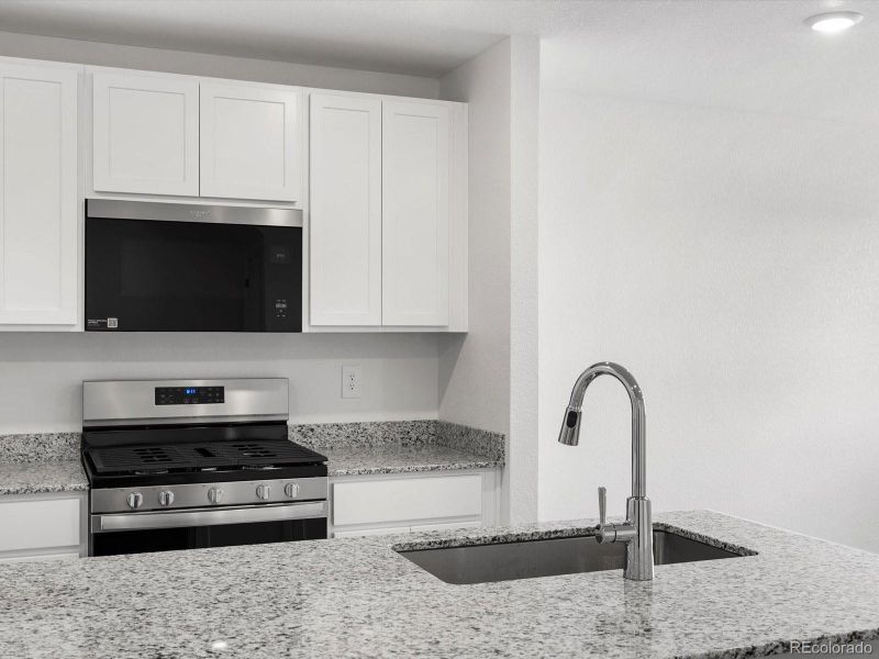 Furnished interior view inside a new home in Skyview at High Point, Aurora (Image 8).