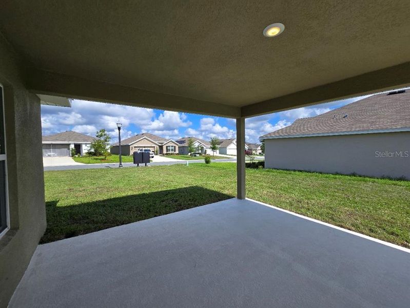 Exterior details and patio area of a home in Twisted Oaks, Beverly Hills (Image 3).