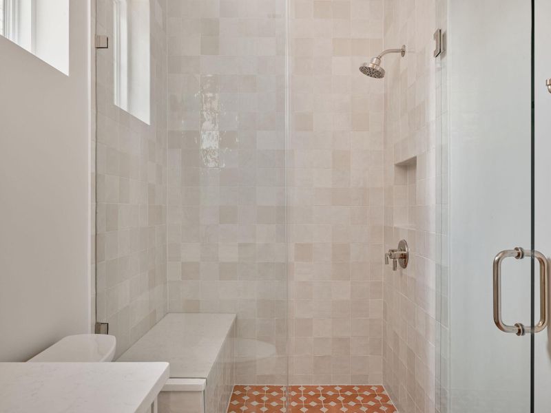 Bathroom featuring a stall shower and vanity Bathroom featuring a stall shower and vanity