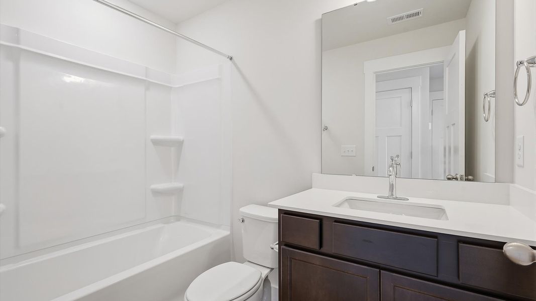 Well-appointed full bath with high standards of craftsmanship and everyday function located at Clarke Townes