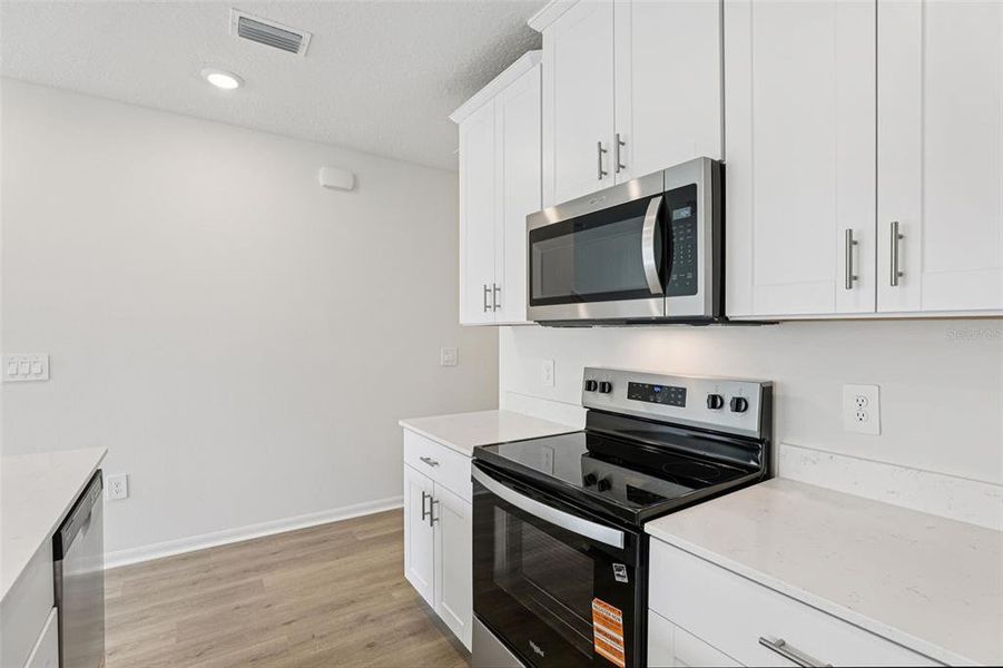 Furnished interior view inside a new home in Cagan Crossings West, Clermont (Image 5).