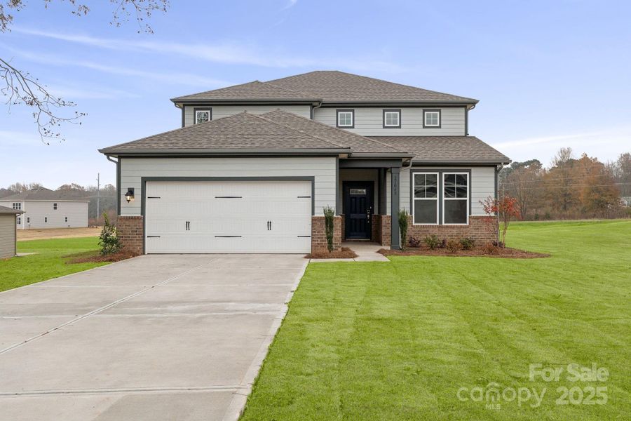 Front exterior of a new home in Running Creek, Locust, NC, highlighting curb appeal (Image 2). Front exterior of a new home in Running Creek, Locust, NC, highlighting curb appeal (Image 2).