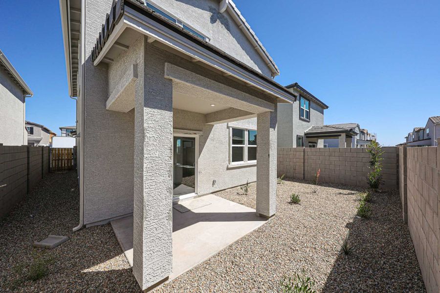 A house with a stone patio. A house with a stone patio.