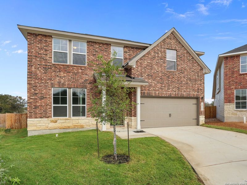 Front exterior of a new home in Royal Crest, San Antonio, TX, highlighting curb appeal (Image 17).