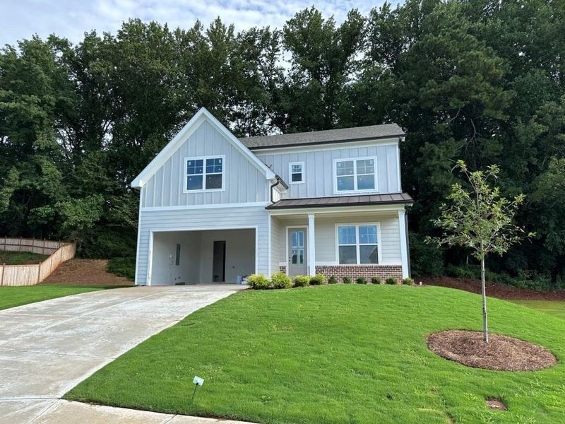 Front exterior of a new home in , Canton, GA, highlighting curb appeal (Image 1).