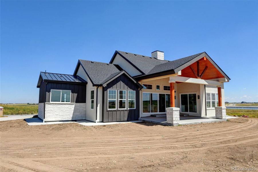 Front exterior of a new home in , Brighton, CO, highlighting curb appeal (Image 1).