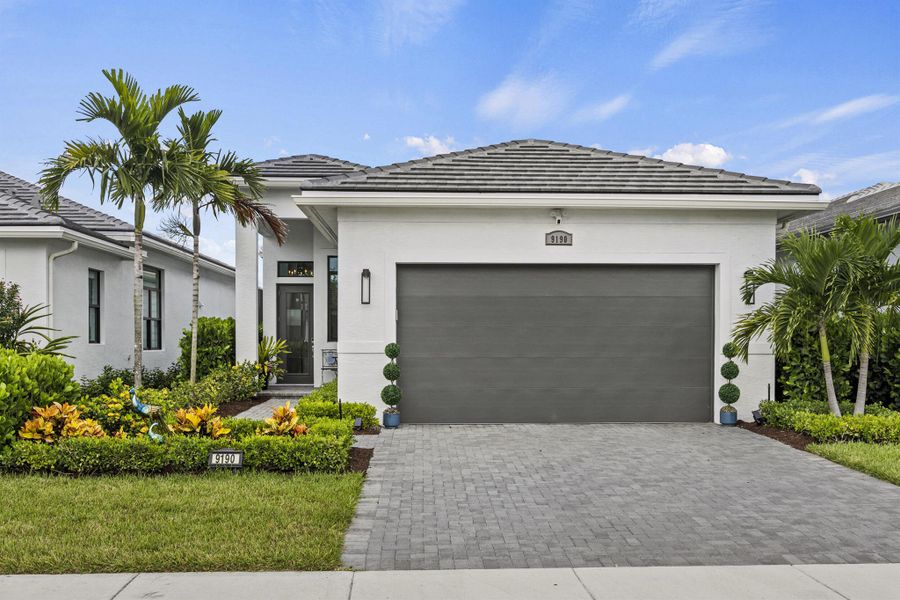 Front exterior of a new home in , Port St. Lucie, FL, highlighting curb appeal (Image 22). Front exterior of a new home in , Port St. Lucie, FL, highlighting curb appeal (Image 22).