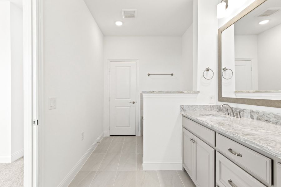 Furnished interior view inside a new home in The Tribute, The Colony (Image 17).