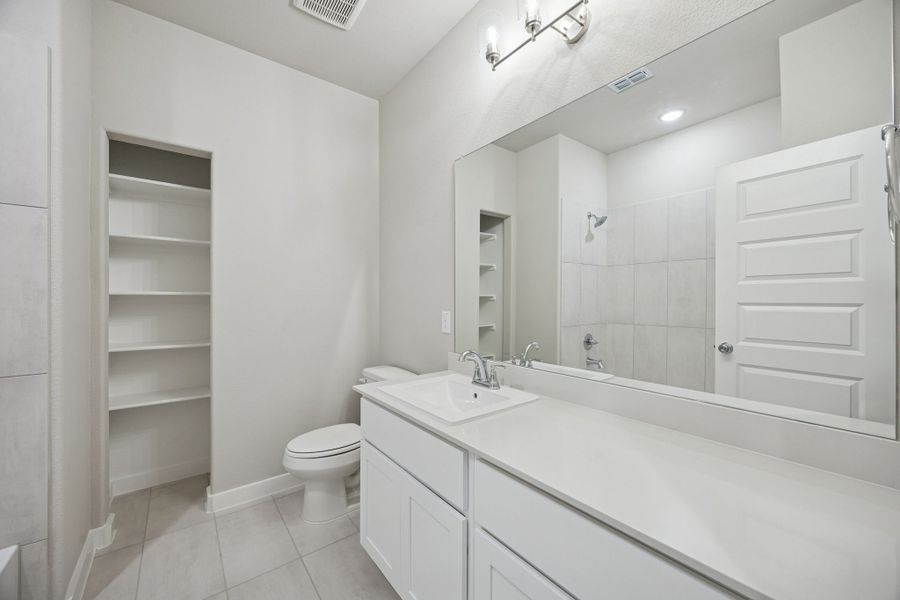 Bathroom in the Stanley II home plan by Trophy Signature Homes – REPRESENTATIVE PHOTO