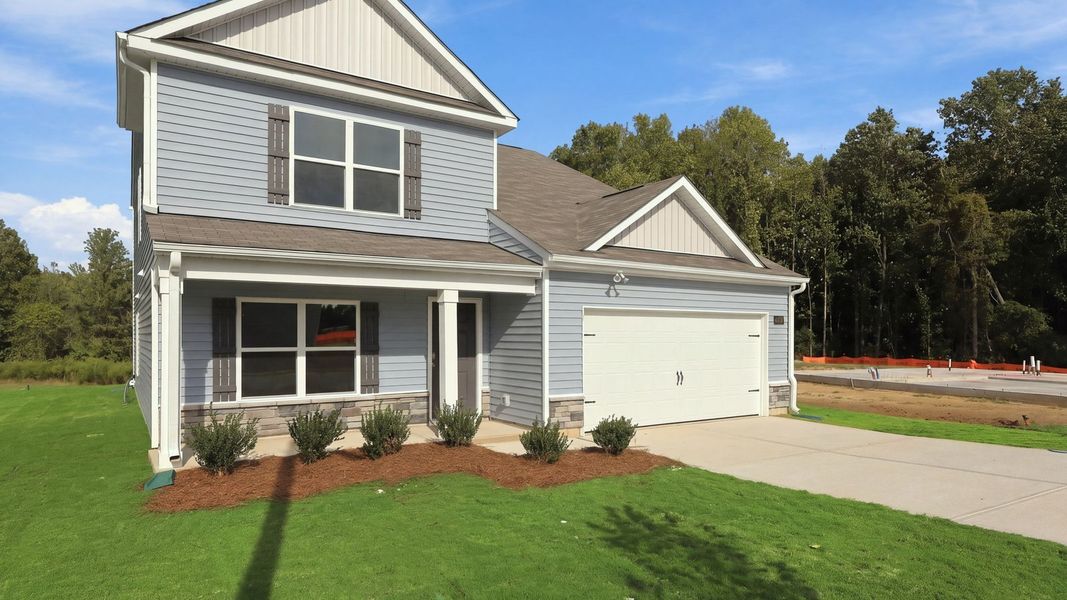 Front exterior of a new home in Bynum Farms, Farmville, NC, highlighting curb appeal (Image 15).