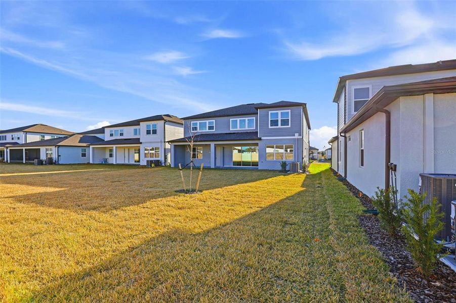 Exterior details and patio area of a home in Vida's Way, Wesley Chapel (Image 29).