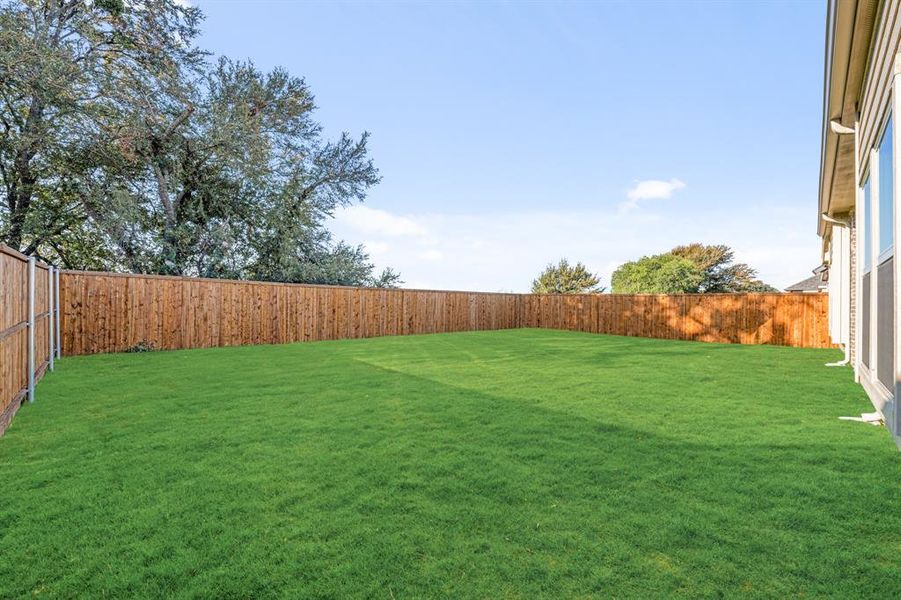Exterior details and patio area of a home in Woodstone, Providence Village (Image 23). Exterior details and patio area of a home in Woodstone, Providence Village (Image 23).