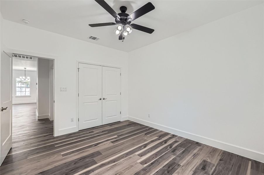 Bedroom #2 featuring a closet, a ceiling fan