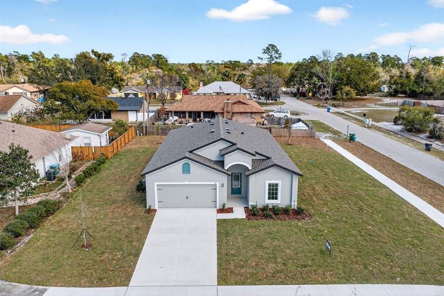 Front exterior of a new home in , Deltona, FL, highlighting curb appeal (Image 23).
