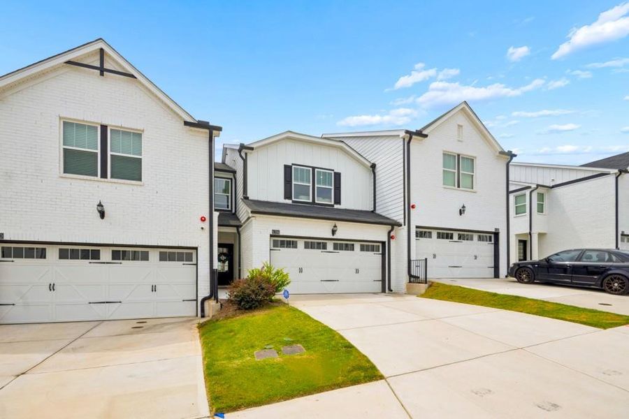 Front exterior of a new home in Brooks at Riverview Landing, Smyrna, GA, highlighting curb appeal (Image 1). Front exterior of a new home in Brooks at Riverview Landing, Smyrna, GA, highlighting curb appeal (Image 1).
