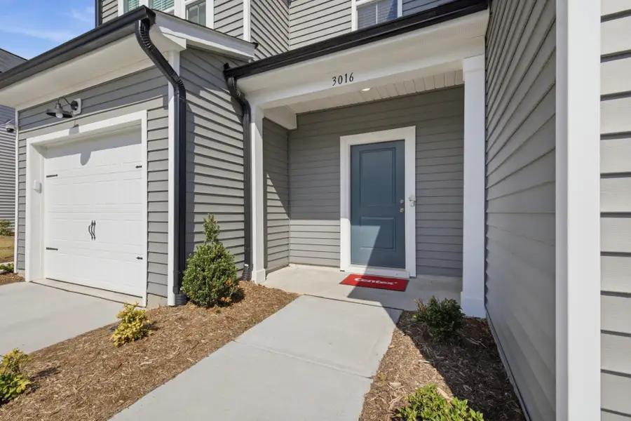 Exterior details and patio area of a home in Carpenter Falls, Durham (Image 3).