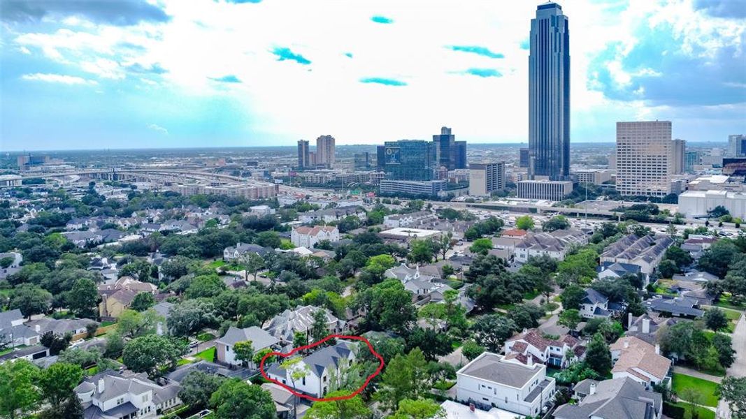 This photo showcases this home in a lush, green neighborhood with close proximity to the vibrant Galleria area. Williams Tower is visible nearby, indicating convenient access to city amenities and business centers.