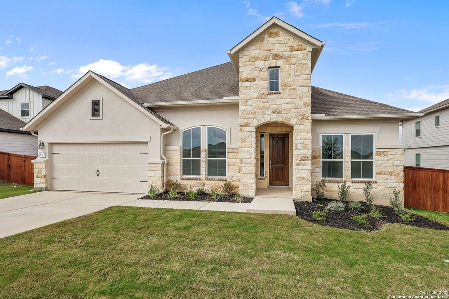 Front exterior of a new home in Homestead 75', Schertz, TX, highlighting curb appeal (Image 21).