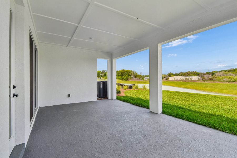 Exterior details and patio area of a home in Oakfield at Mount Dora Village Series, Mount Dora (Image 4).