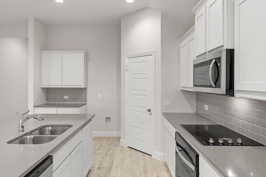 Representative exterior photo of a completed home built from the Kingston by Impression Homes in Timberbrook, Justin, TX (Image 8).