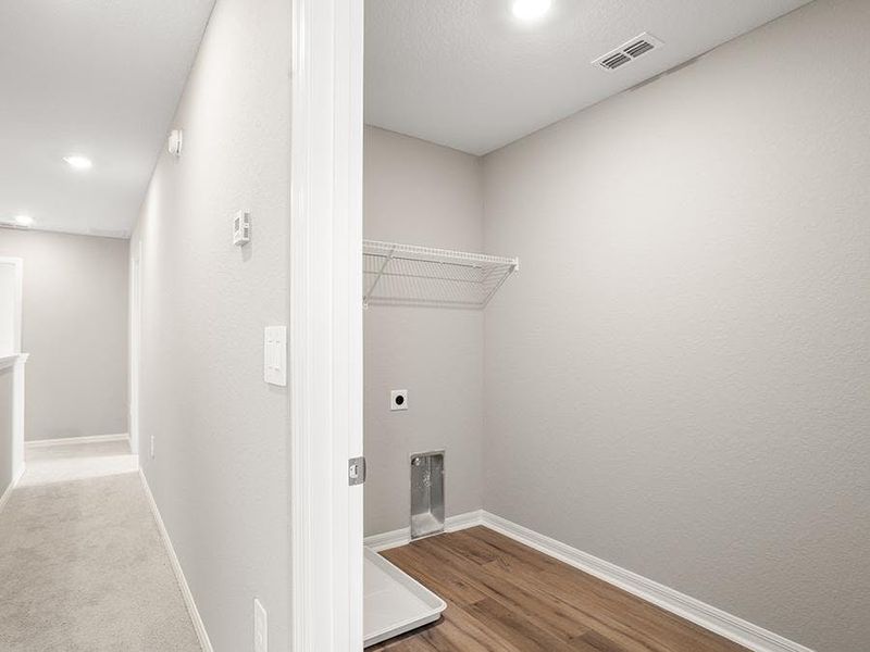 The laundry is conveniently located near the bedrooms - Bimini townhome by Highland Homes