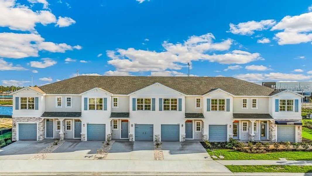 Front exterior of a new home in Ashcombe Wellen Park, Venice, FL, highlighting curb appeal (Image 19). Front exterior of a new home in Ashcombe Wellen Park, Venice, FL, highlighting curb appeal (Image 19).