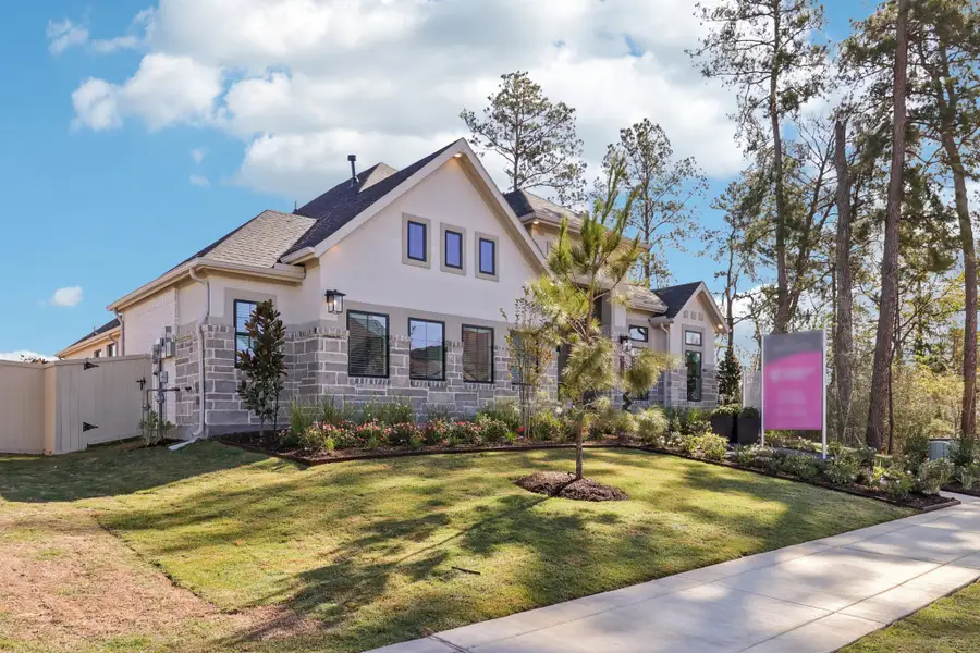 Front exterior of a new home in Audubon, Magnolia, TX, highlighting curb appeal (Image 2). Front exterior of a new home in Audubon, Magnolia, TX, highlighting curb appeal (Image 2).