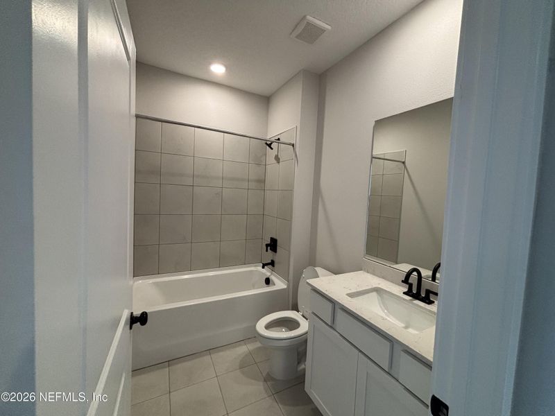 Furnished interior view inside a new home in The Cypress Series at Reserve East, Flagler Beach (Image 8).
