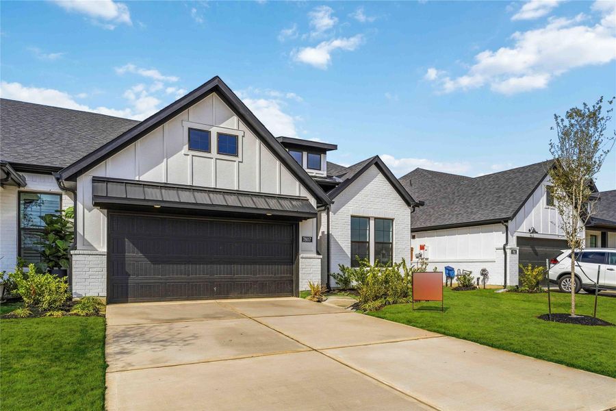 Front exterior of a new home in Elyson, Katy, TX, highlighting curb appeal (Image 21). Front exterior of a new home in Elyson, Katy, TX, highlighting curb appeal (Image 21).
