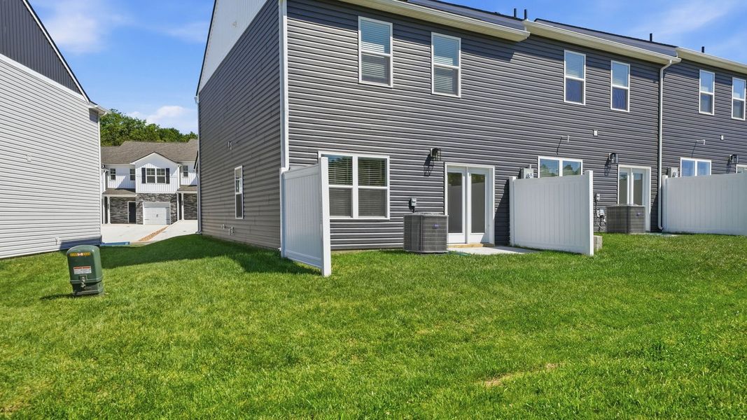 Exterior details and patio area of a home in The Arbor Townhomes, Kingsport (Image 20).