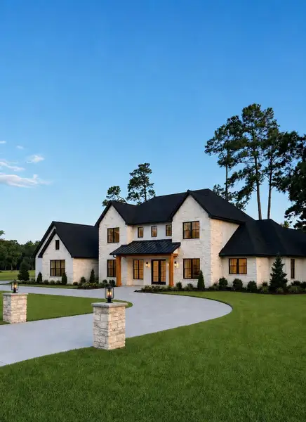 Custom driveway pillars with coping caps and integrated lighting create a grand, upscale entrance. Custom driveway pillars with coping caps and integrated lighting create a grand, upscale entrance.