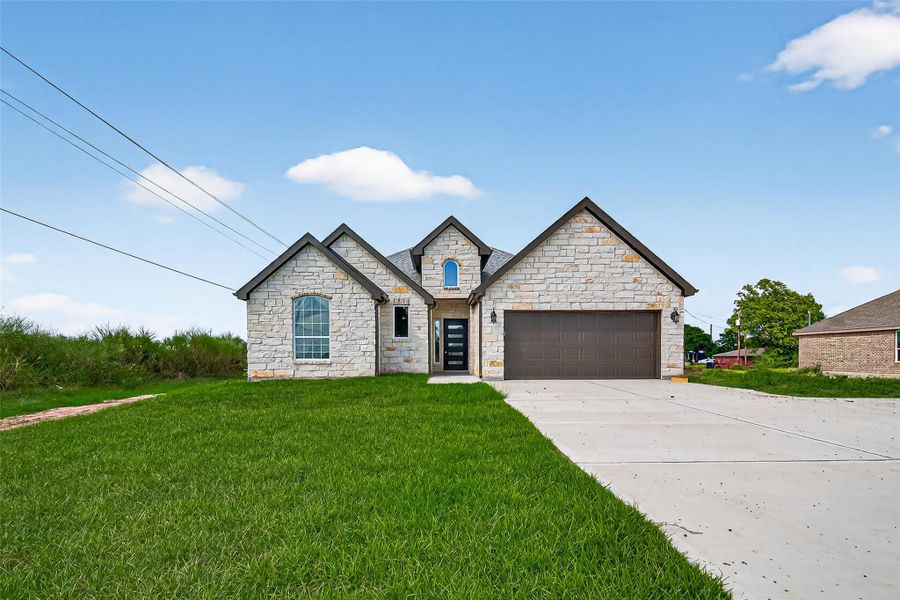 Front exterior of a new home in , Prairie View, TX, highlighting curb appeal (Image 25).