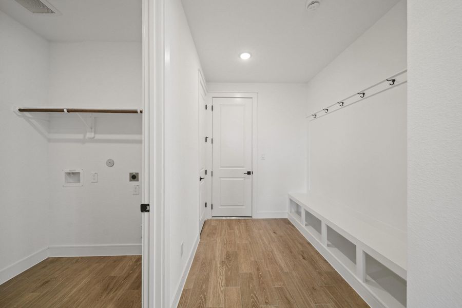 Laundry room with valet in the hall (*Photo not of actual home and used for illustration purposes only.)
