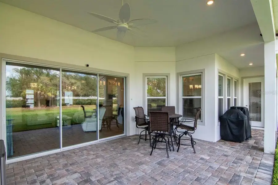 Exterior details and patio area of a home in River's Edge, Wesley Chapel (Image 3).
