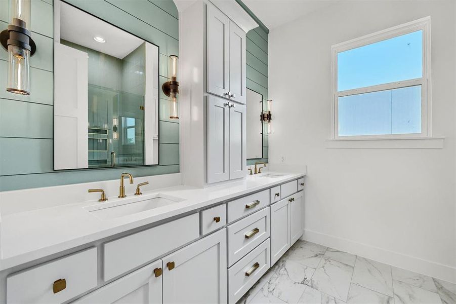 Bathroom with tile patterned flooring and double sink vanity