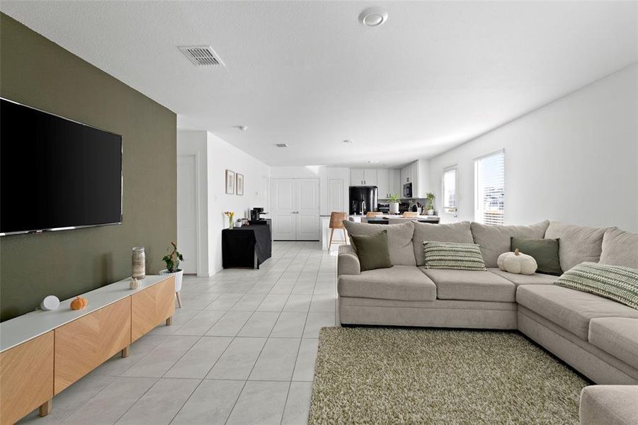 Living area with light tile patterned flooring