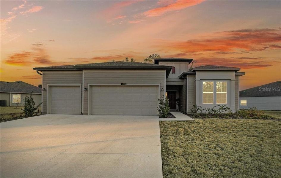 Front exterior of a new home in Grand Park North, Dunnellon, FL, highlighting curb appeal (Image 29).