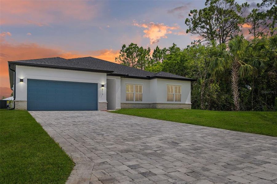 Front exterior of a new home in , Sebastian, FL, highlighting curb appeal (Image 1).