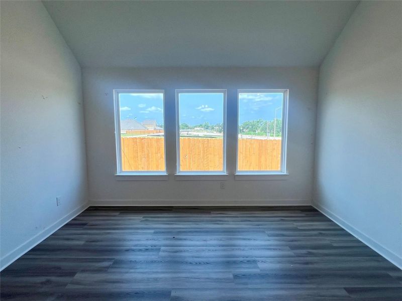 Empty room with dark wood-style floors
