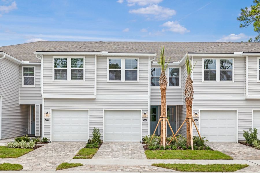 Front exterior of a new home in Egret Creek, Jacksonville, FL, highlighting curb appeal (Image 1).