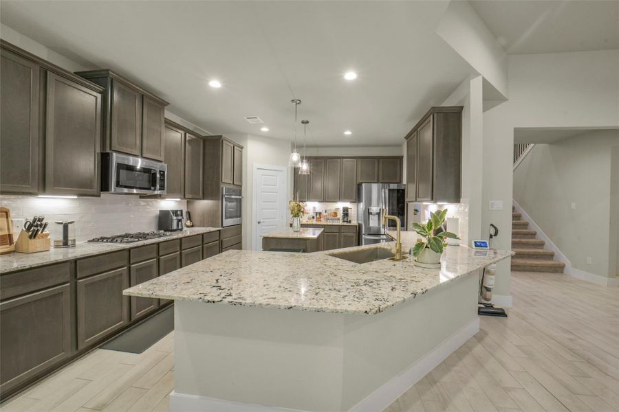 Chef inspired kitchen featuring a large center island.