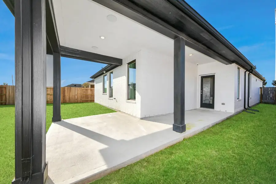 Exterior details and patio area of a home in Sunterra: Premier Collection, Katy (Image 3).