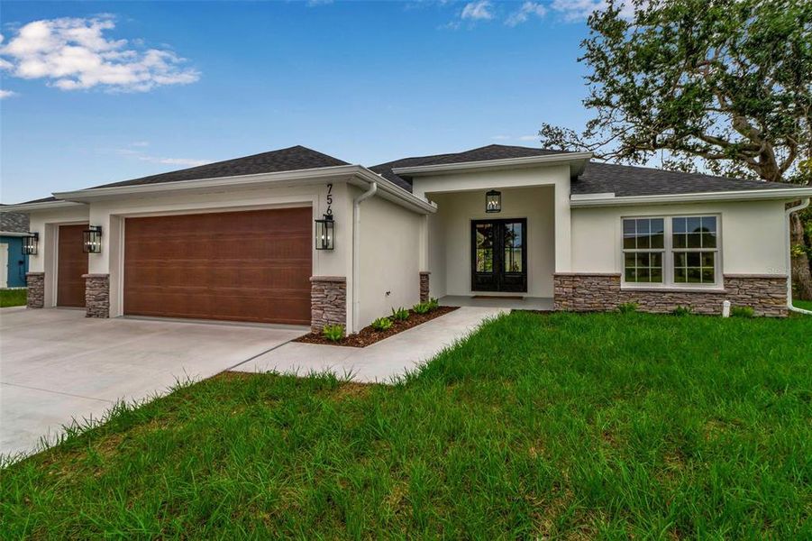 Front exterior of a new home in , Venice, FL, highlighting curb appeal (Image 1).