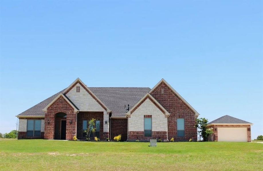 Front exterior of a new home in , Weatherford, TX, highlighting curb appeal (Image 16).