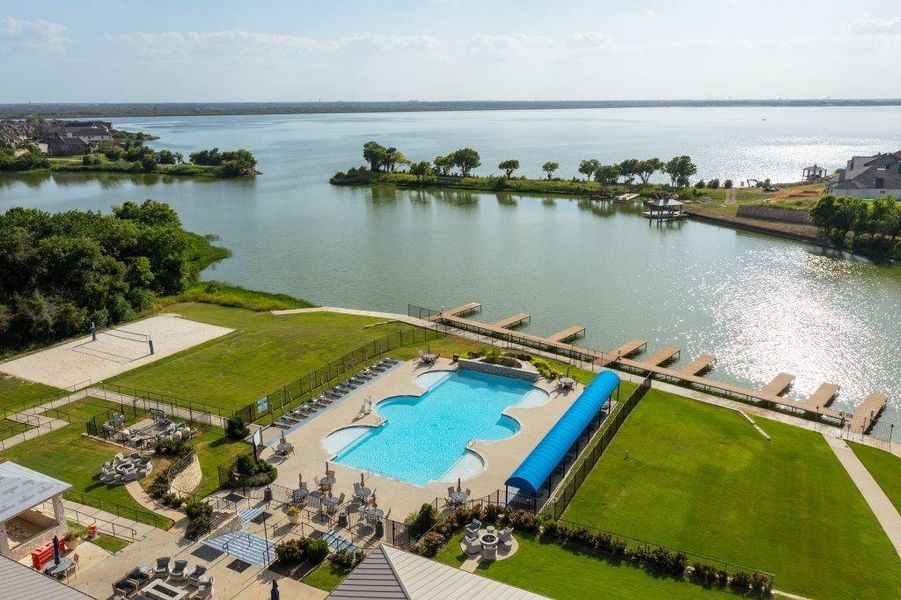 Bird's eye view of a nearby body of water and a pool area Bird's eye view of a nearby body of water and a pool area