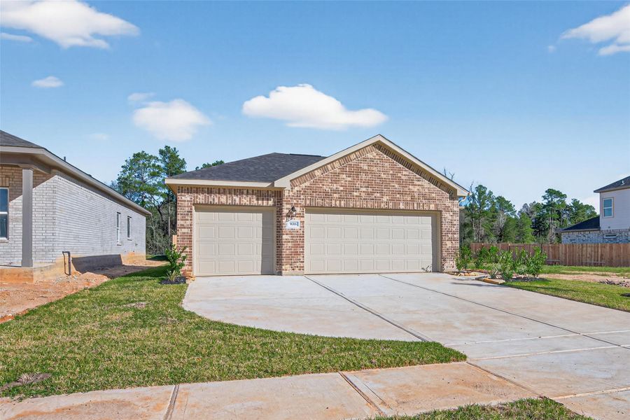 Front exterior of a new home in Enclave at Willis, Willis, TX, highlighting curb appeal (Image 18).