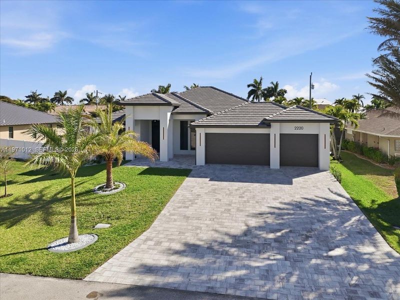 Front exterior of a new home in , Cape Coral, FL, highlighting curb appeal (Image 24).
